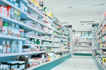 Cropped shot of fully stocked shelves in an aisle of a pharmacy